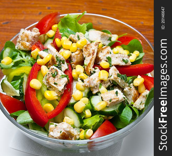 Chicken salad with cherry tomatoes and rucola (shallow DOF)