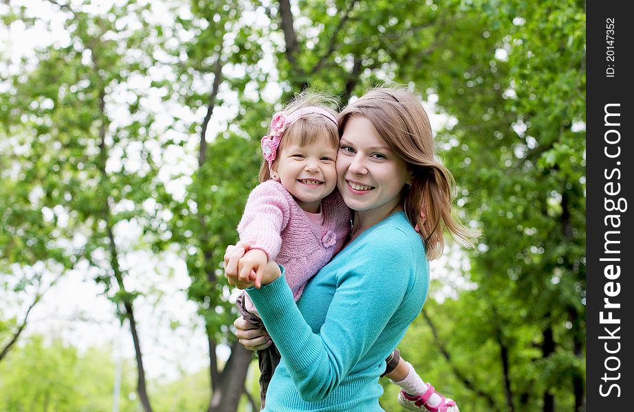 Portrait of mother with her little daughter outdoor. Portrait of mother with her little daughter outdoor