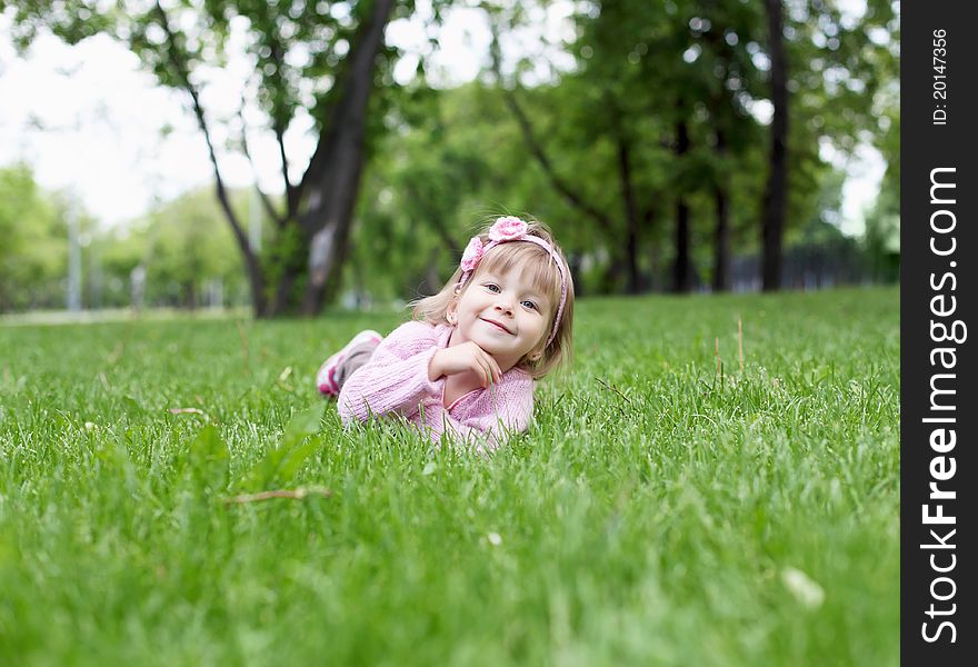 Portrait of a happy little girl in the park. Portrait of a happy little girl in the park