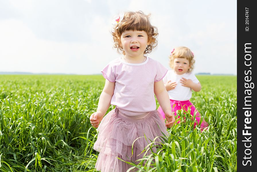 Portrait of a happy little girl outdoors in summer. Portrait of a happy little girl outdoors in summer