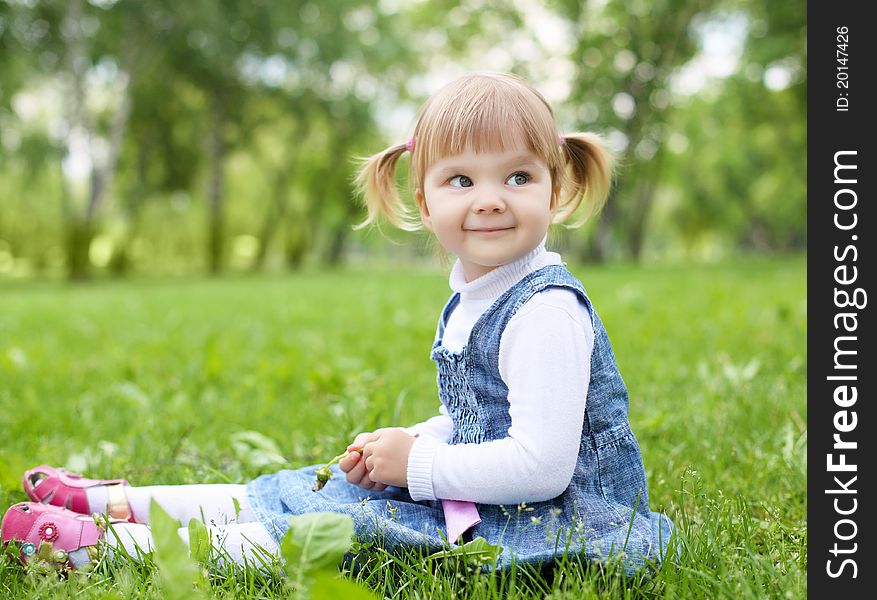 Portrait of a happy little girl in the park. Portrait of a happy little girl in the park