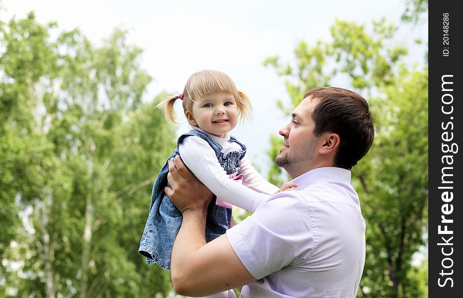 Portrait of father with daughter outdoor