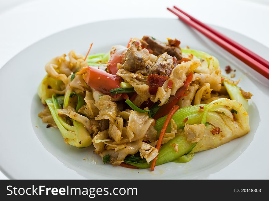 Rice noodle stir fried with roasted duck. It is a very famous dish in Thailand. Rice noodle stir fried with roasted duck. It is a very famous dish in Thailand.