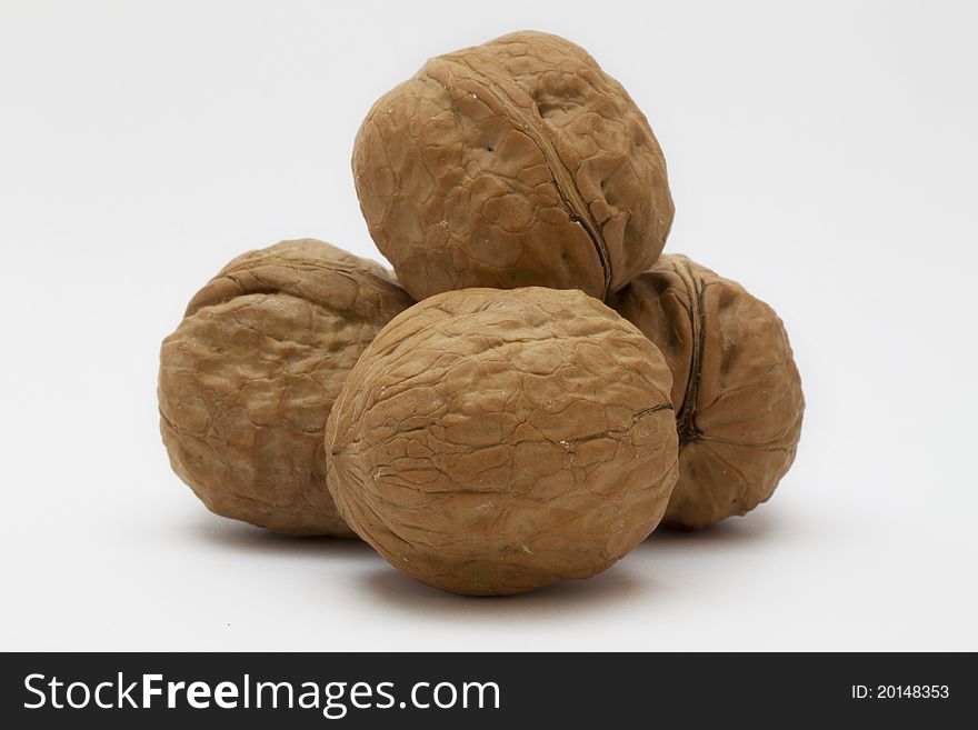 Three walnuts on a white background. Three walnuts on a white background