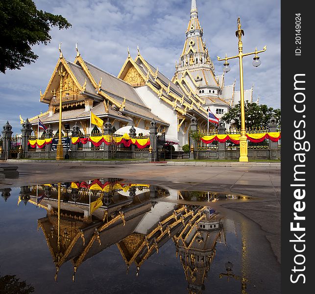 Thai temple with mirror and nice blue sky. This photo from Sothon temple, Thailand.