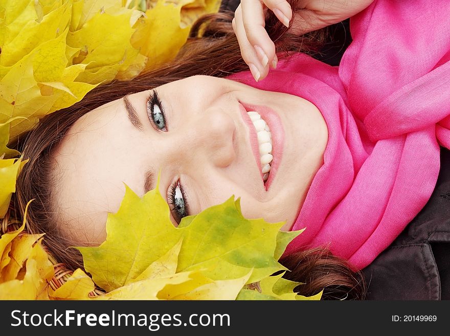 Beautiful woman in the autumnal garland from leaves. Beautiful woman in the autumnal garland from leaves
