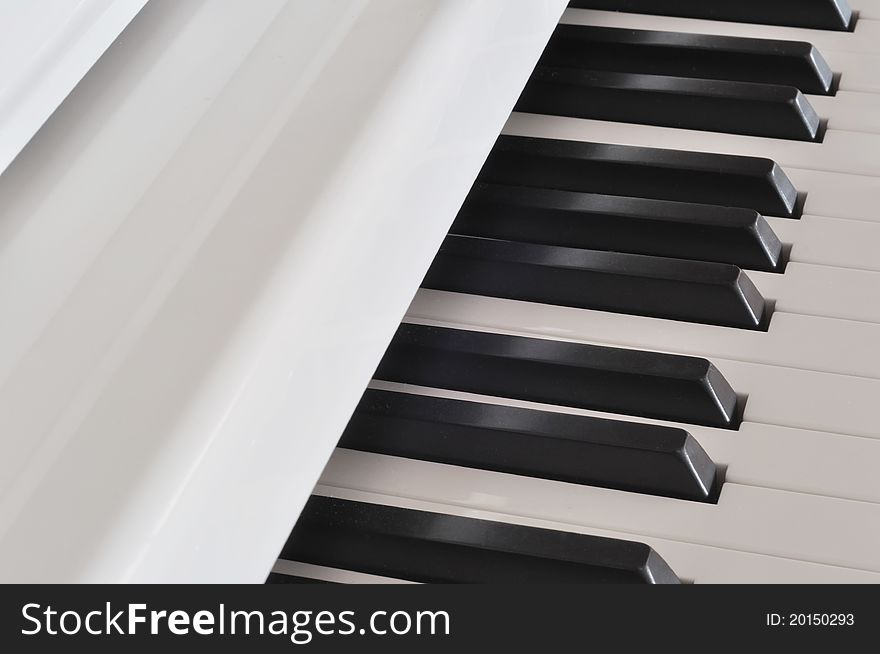 Beautiful white piano and keyboard. Beautiful white piano and keyboard