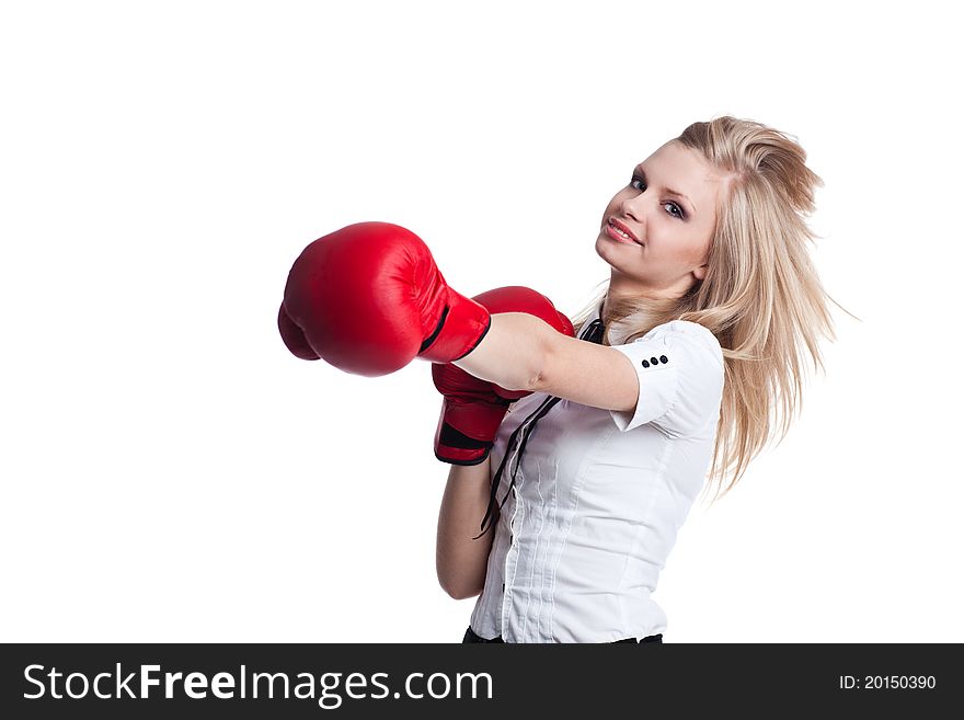 Portrait of beautiful and young business woman wearing boxing gloves. Portrait of beautiful and young business woman wearing boxing gloves