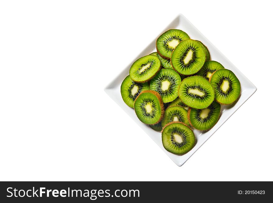 Kiwi fruit on a white plate and background.