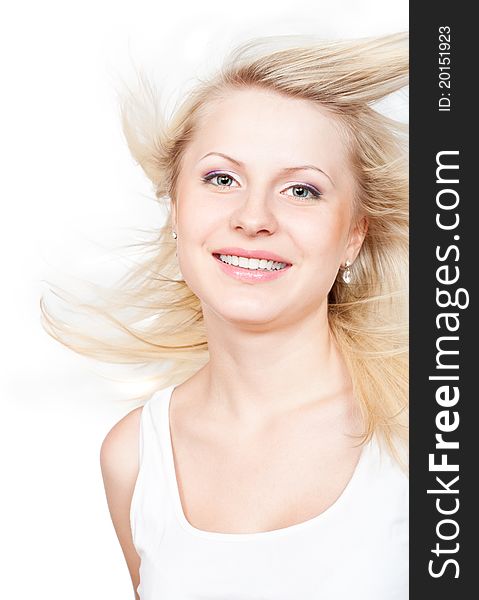 Beautiful blonde with a flying hair. Isolated on white background