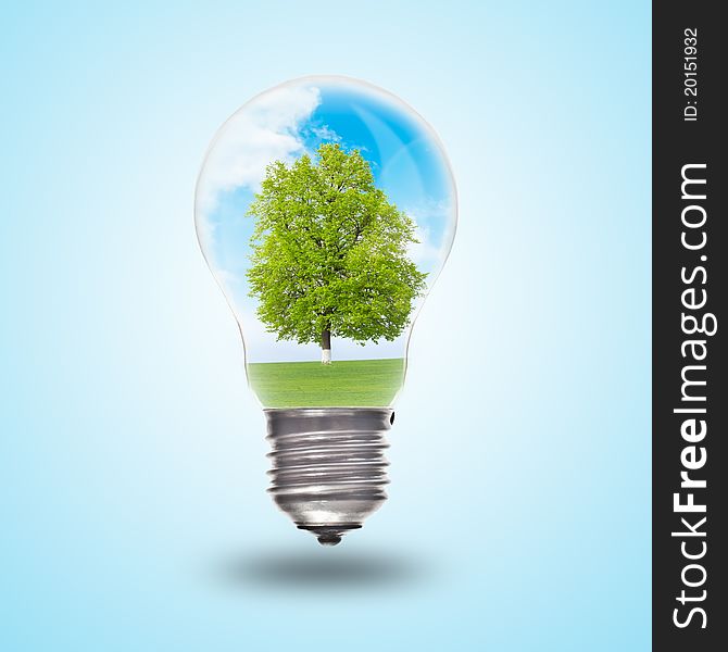 Light bulb with landscape inside. Environmental concept Renewable Energy