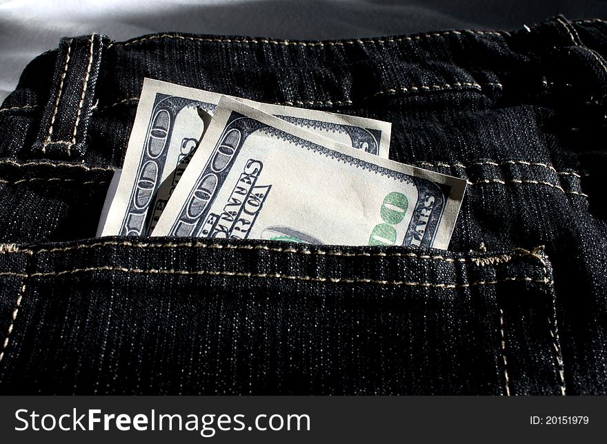 Two  x 1 hundred US dollar bill in the backpocket of the jeans. Two  x 1 hundred US dollar bill in the backpocket of the jeans
