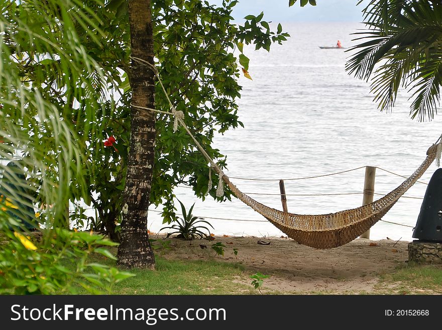 A hammock by the beach on a cool relaxing summer in Moalboal, Cebu, Philippines.