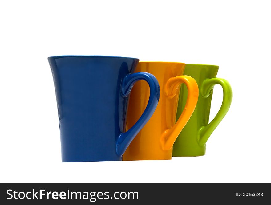 Stacks of colored cups isolated on white background.