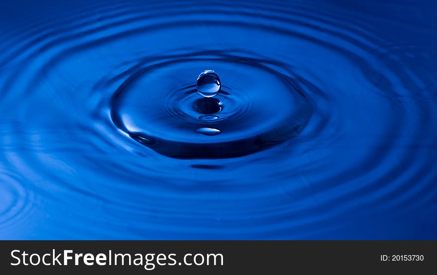 The round drop of blue water. The round drop of blue water
