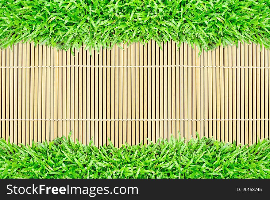 Grass frame on bamboo texture background