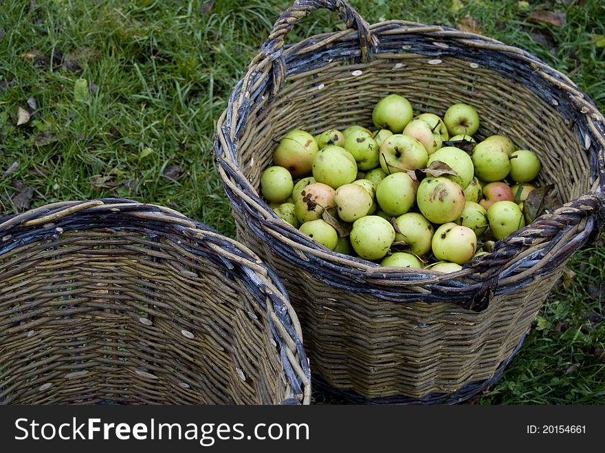 Half-empty or half-full basket with fresh green apples. Half-empty or half-full basket with fresh green apples