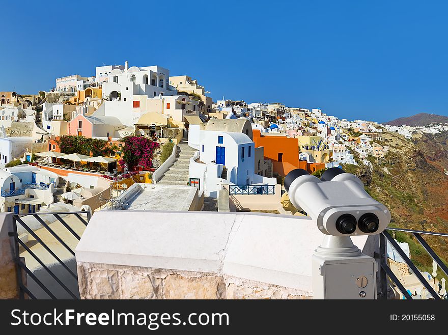 Binoculars and Santorini view (Oia), Greece - vacation background