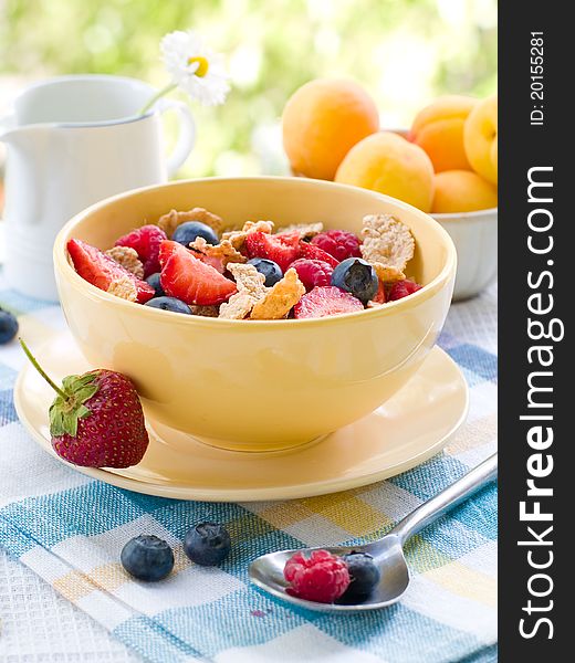 Corn flakes with fresh berries. Selective focus. Corn flakes with fresh berries. Selective focus