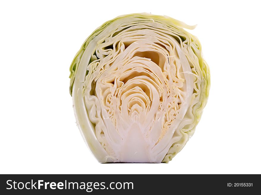 A portion of sliced green cabbage on white. A portion of sliced green cabbage on white