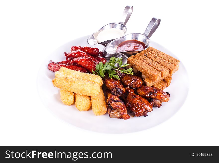 Dish meal, chicken, sausage, potatoes, toast.