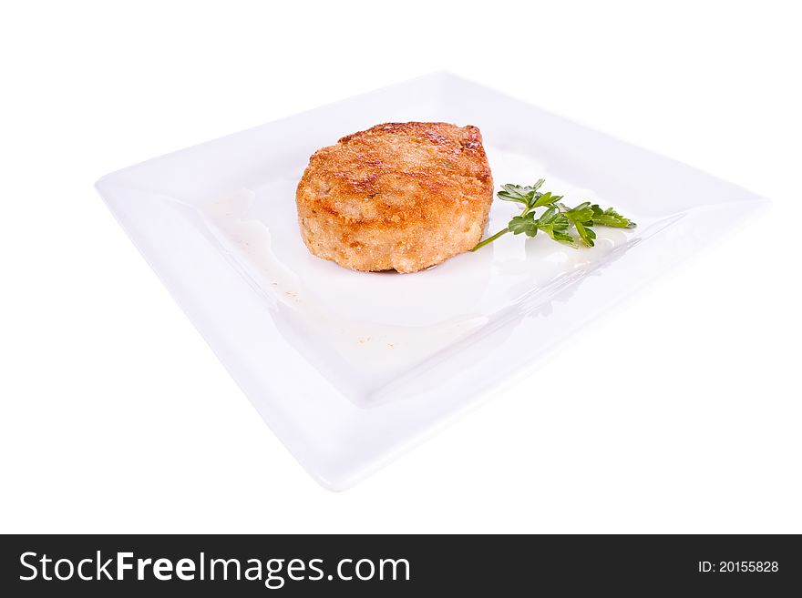 Chop in breadcrumbs. on a plate. on a white background. Chop in breadcrumbs. on a plate. on a white background.