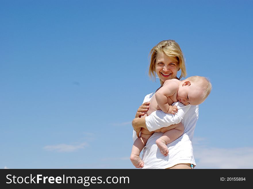 Happy mother and baby playing