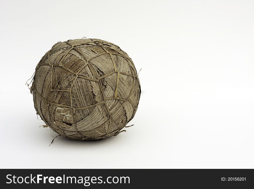 A soccer ball (football) made out of grass and banana leaves from Rwanda. This is used to play football on the street as a cheaper alternative to a leather ball. A soccer ball (football) made out of grass and banana leaves from Rwanda. This is used to play football on the street as a cheaper alternative to a leather ball.