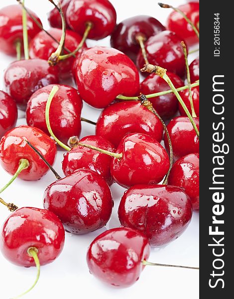 Seasoned red cherries on white background. Seasoned red cherries on white background
