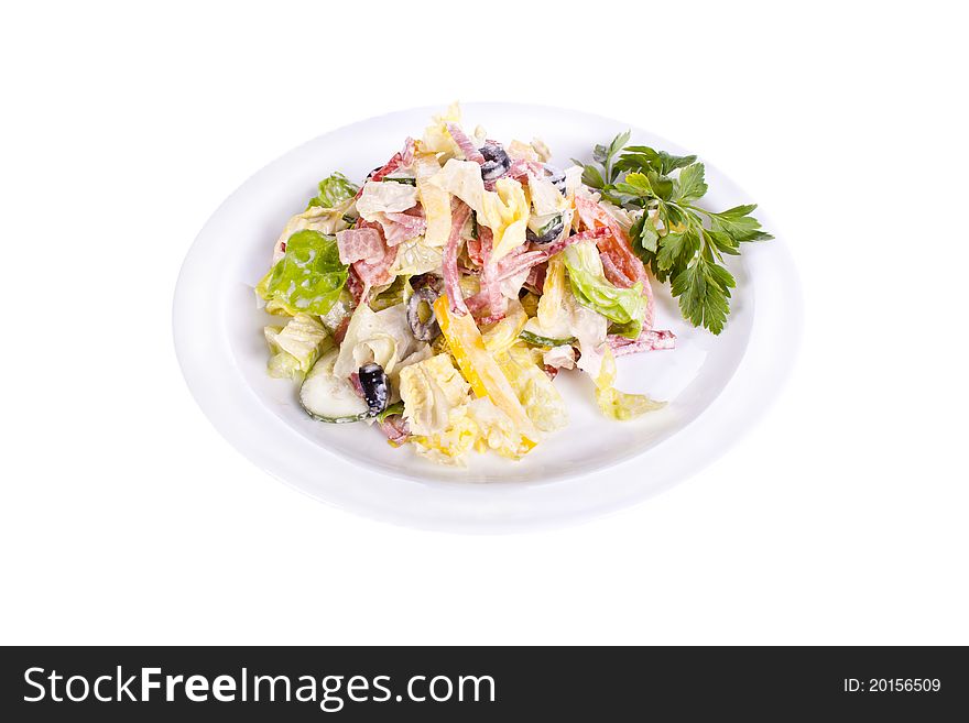 Salad of ham, bacon, tomatoes, cucumbers, olives on a plate. Salad of ham, bacon, tomatoes, cucumbers, olives on a plate.