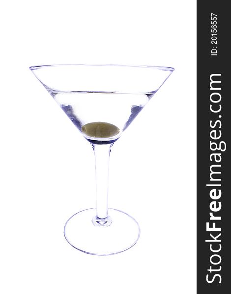 Martini with an olive on a skewer. On a white background. Martini with an olive on a skewer. On a white background.