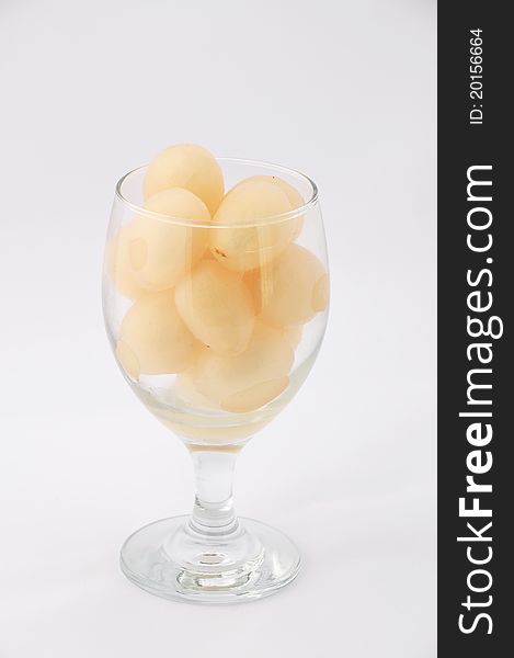 A glass with full of lychee fruits from the tropical. A glass with full of lychee fruits from the tropical.