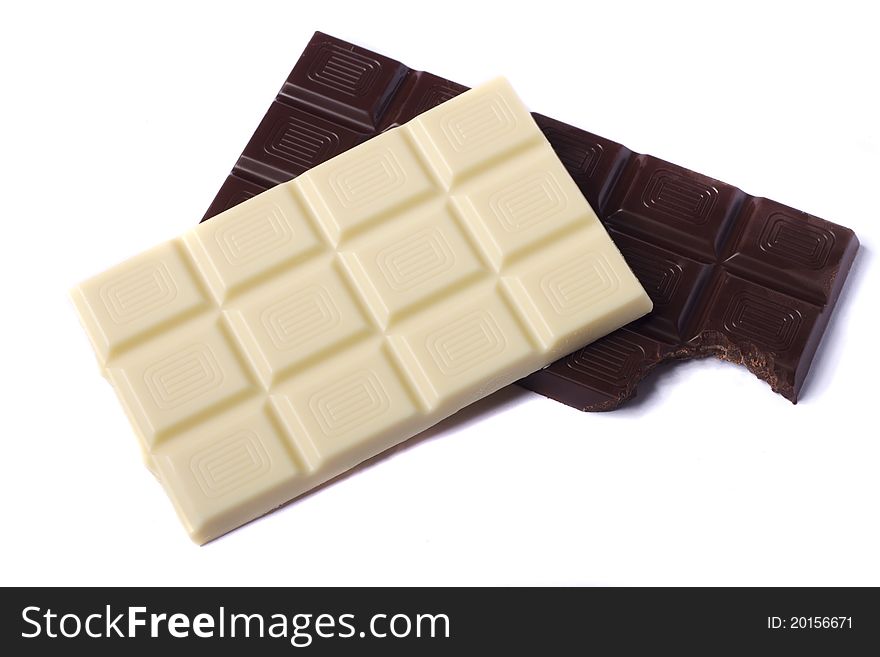 Close view of a dark chocolate bar isolated on a white background.