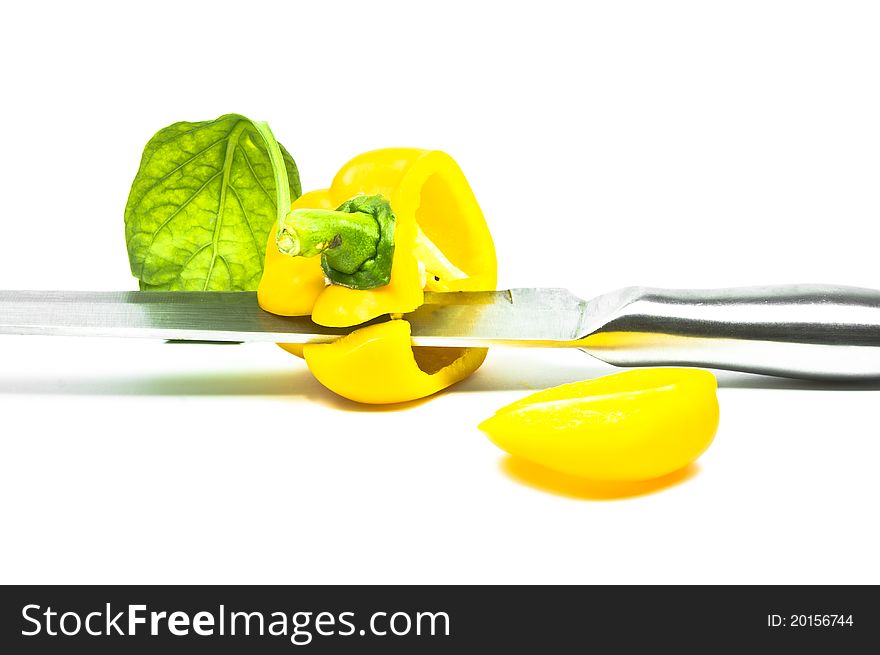 Yellow Sweet Pepper with Knife Isolation with white background. Yellow Sweet Pepper with Knife Isolation with white background