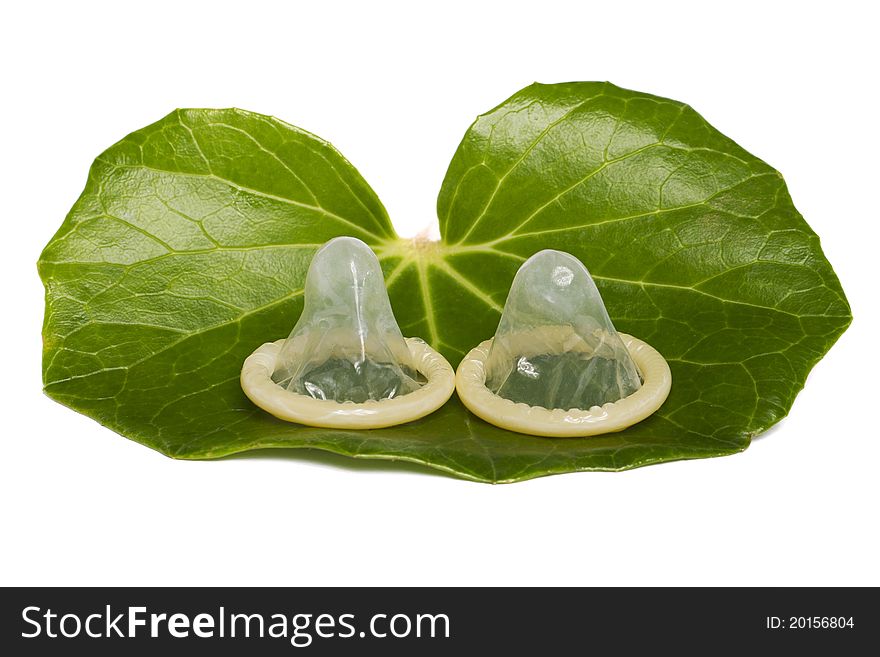 Two Condoms On A Green Leaf