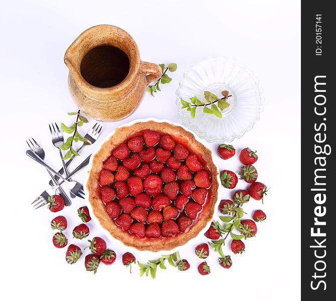 Strawberry Tart, plates, a pot, strawberries and mint twigs