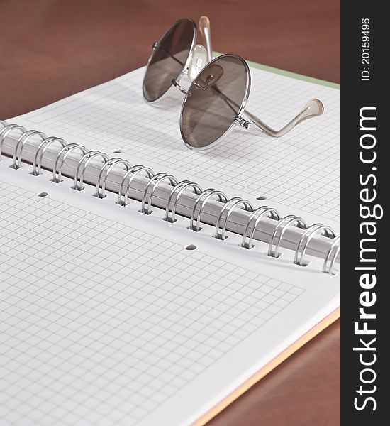 Open Notebook And Glasses