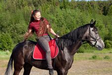 Beautiful Girl On Black Horse Stock Photography