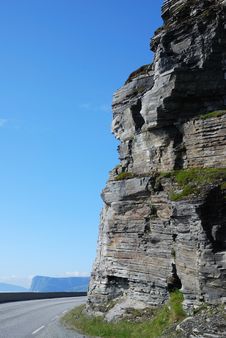 Vertical Cliff And Serpentine Road. Stock Image