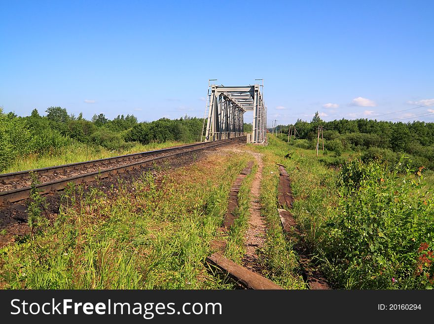 Old railway bridge through small river