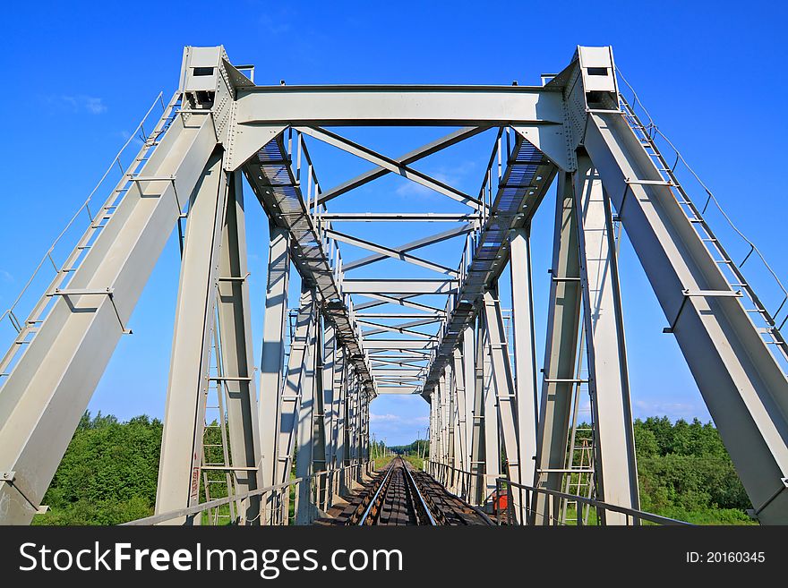 Railway bridge through small river