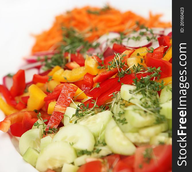 Fresh salad with peppers and cucumbers - square - close up