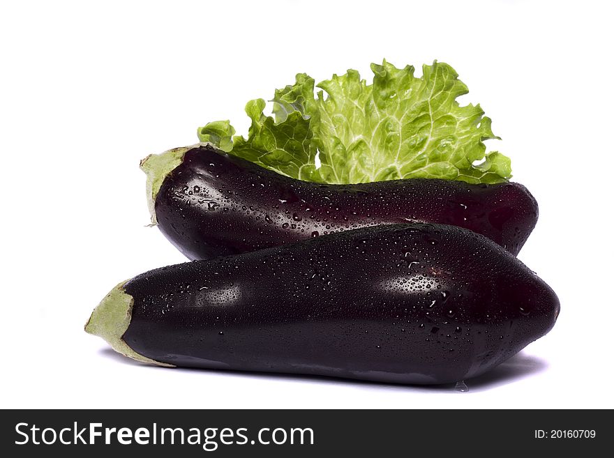 Close up view of an eggplant vegetable isolated on a white background. Close up view of an eggplant vegetable isolated on a white background.