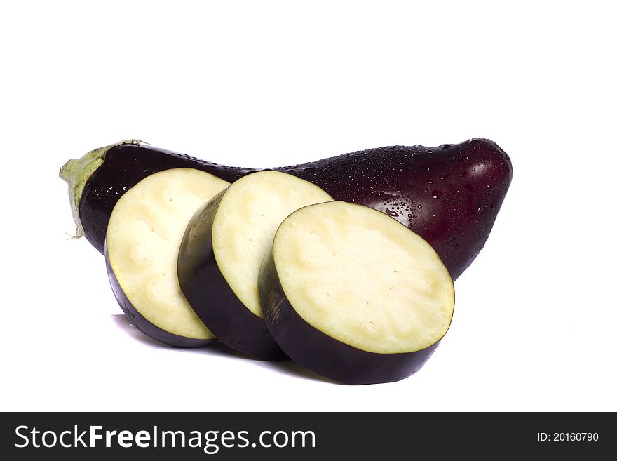 Close up view of an eggplant vegetable isolated on a white background. Close up view of an eggplant vegetable isolated on a white background.