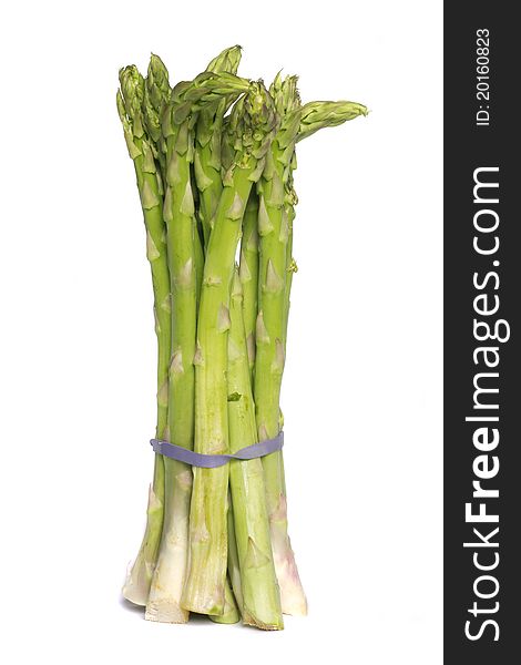 Close up view of a bunch of asparagus vegetable isolated on a white background. Close up view of a bunch of asparagus vegetable isolated on a white background.