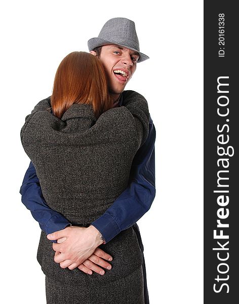 Hugging couple''s portrait isolated on white background