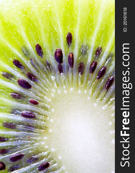 Close-up image of the inner part of kiwi fruit, reveals the textures, patterns, color and seeds. Close-up image of the inner part of kiwi fruit, reveals the textures, patterns, color and seeds.