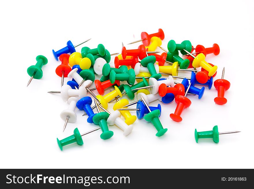 Colored plastic pins. Isolated on white background