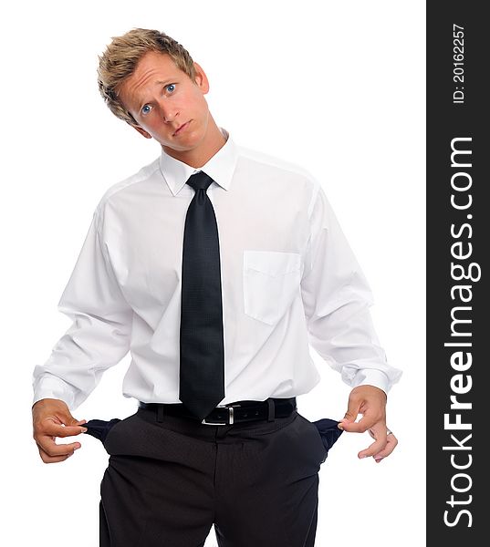 Caucasian man in shirt and tie pulls on his empty pockets. Caucasian man in shirt and tie pulls on his empty pockets