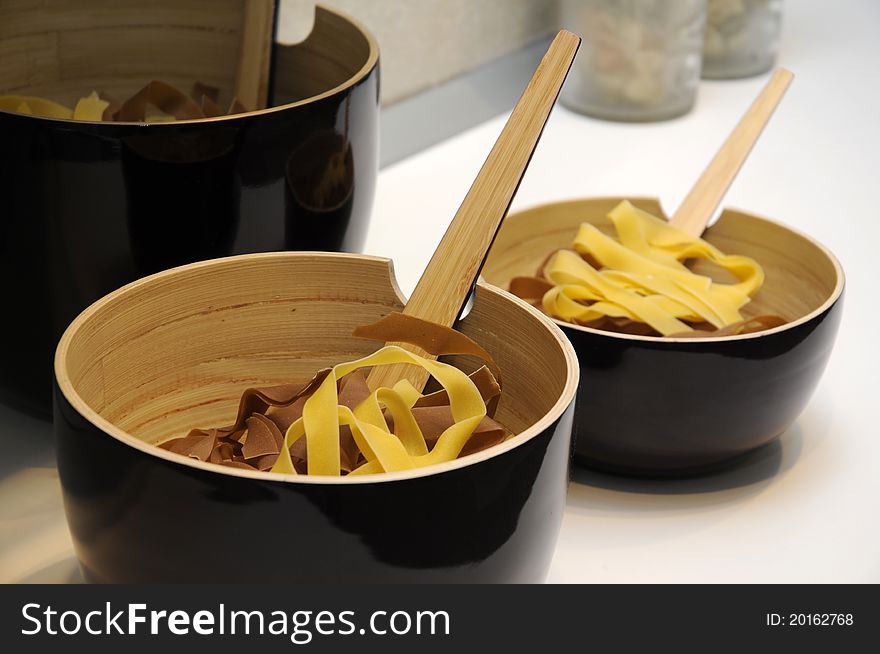 Bowl of raw pasta on white table. Bowl of raw pasta on white table.